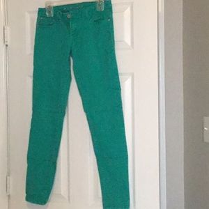 Green, skinny jean
